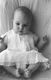 Vanessa took this picture of Corynn in the dress that was Vanessa's as a baby.